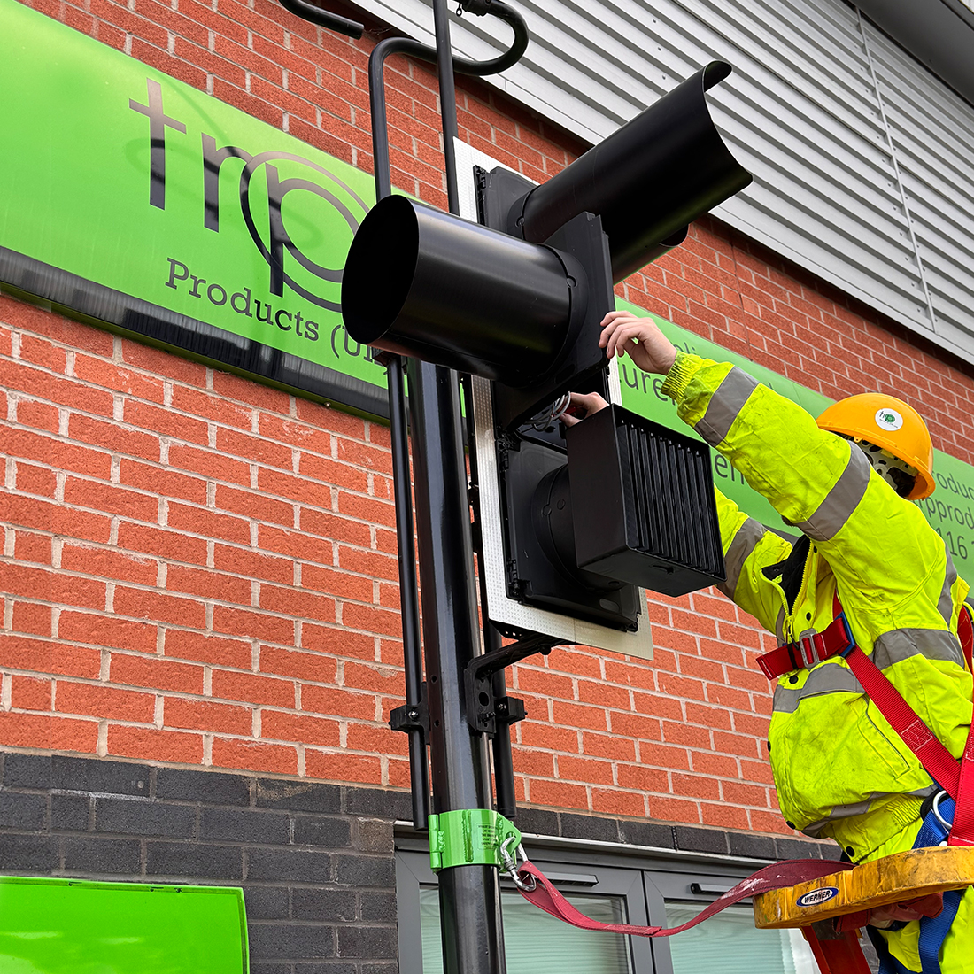 TRP Traffic light hood being installed